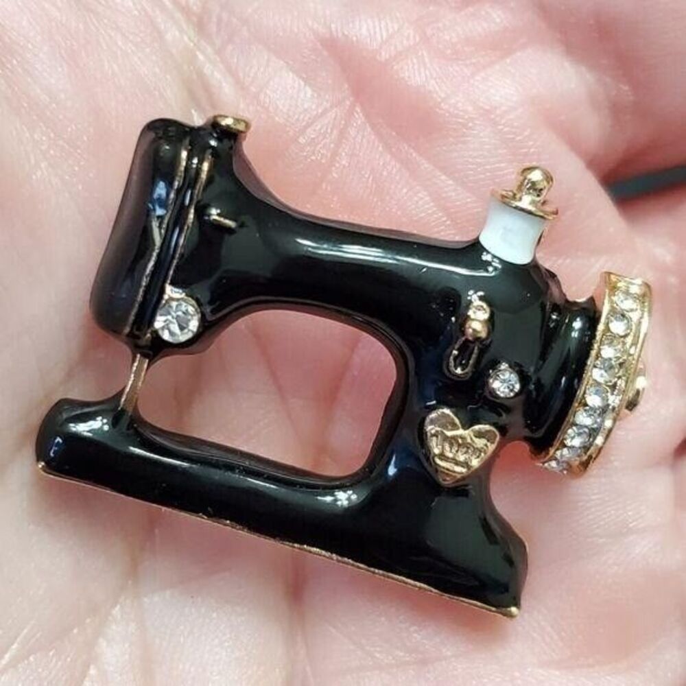 Black enamel sewing machine brooch